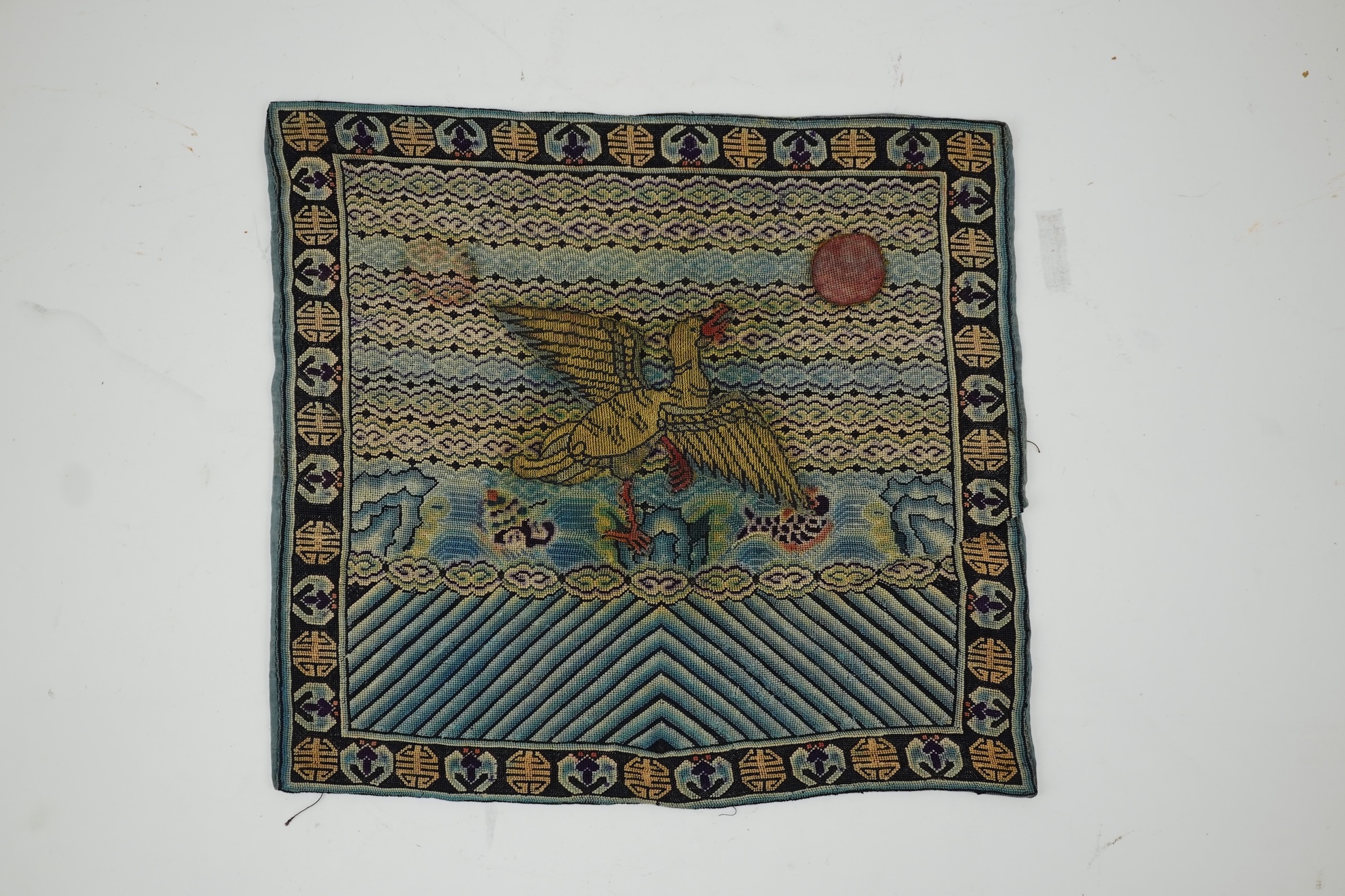 A Chinese needlepoint rank badge, 19th century